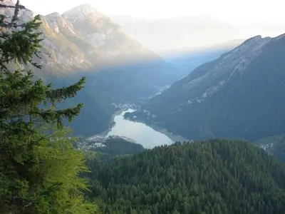 a view of a valley in the mountains with a lake at Cesa DOLOMITI in Rocca Pietore