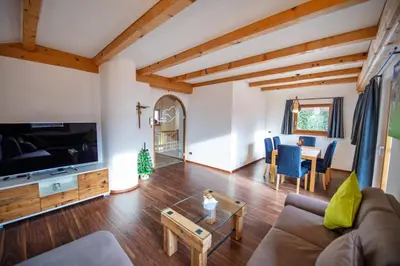 a living room with a couch and a table at Chalet Aghel in Santa Cristina in Val Gardena