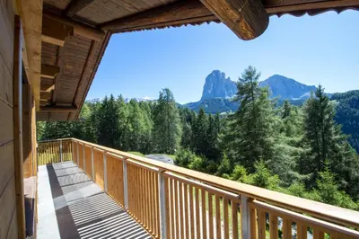 a balcony with a view of the mountains at Chalet Aghel in Santa Cristina in Val Gardena