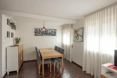 a dining room with a table and chairs at Casa Faloria in Cortina dʼAmpezzo