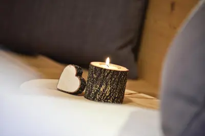 a candle sitting on top of a table at Forchnerhof Panorama - Dolomitenblick in Rodengo