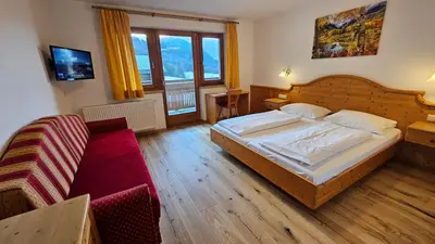 a bathroom with a sink and a shower with a window at Hotel Pichlerhof in San Lorenzo di Sebato