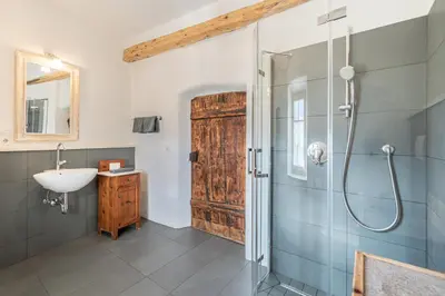 a bathroom with a sink and a shower at Ansitz Romani in Termeno