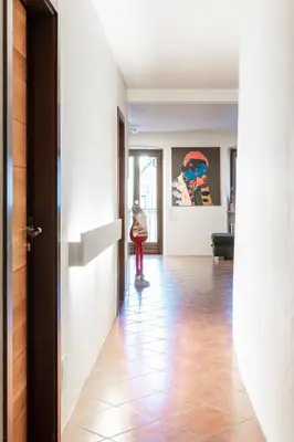 a person riding a skateboard down a hallway at Apartment Goethe 1 in Bolzano