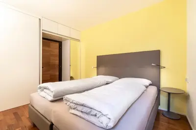 a bedroom with two white pillows on a bed at Apartment Goethe 1 in Bolzano