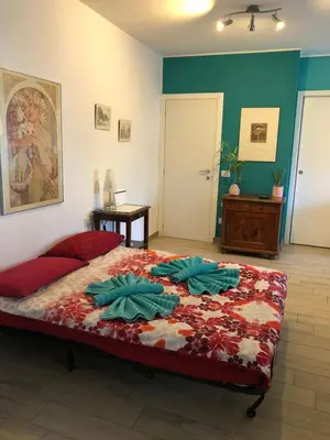 a bedroom with a large bed in a room at Casa Turchese in Merano