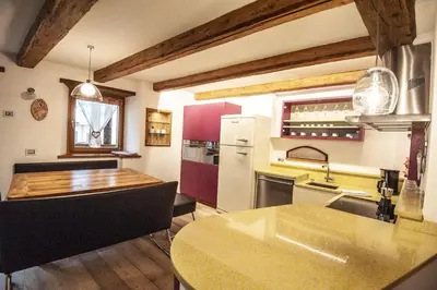a kitchen with a sink and a counter top at Chalet Tobià Villa in Canazei
