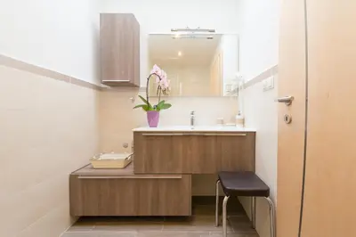 a small bathroom with a sink and a mirror at St. Urbanhof in Termeno