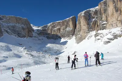 a group of people skiing on a snow covered mountain at Chalet alla Cascata in Badia