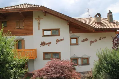 a house with the words happy christmas written on it at Garnì Goccia d'Oro in Cavalese