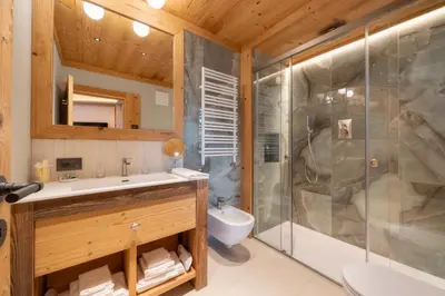 a bathroom with a shower and a sink at Villa Oretta in Cortina dʼAmpezzo