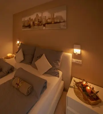 a house with a large yard next to a building at Penthouse & Garden - luxury apartment in Postal