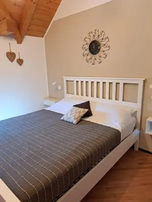 a bedroom with a bed in a room at VILLA ROOMS in Laives