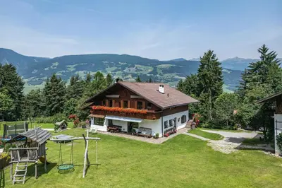a house with a garden and a playground at Wieshof in Laion