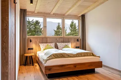 a bedroom with a bed in a room with a window at Wieshof in Laion