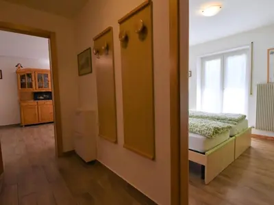 a room with a bedroom with a bed and a window at Apartment Cesa Lucilla by Interhome in Canazei