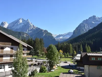 a view of a village with mountains in the background at Apartment Cesa Lucilla by Interhome in Canazei