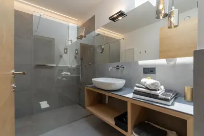 a bathroom with a sink and a shower at Feldhof Vilpian- Urlaub auf dem Bauernhof in Vilpiano