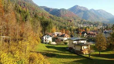 a village in a valley with mountains in the background at Appartamenti Dolomiti in Colcerver