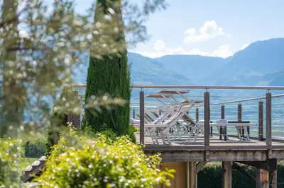 an empty living room with a sliding glass door at B&B Garni Erika in Termeno