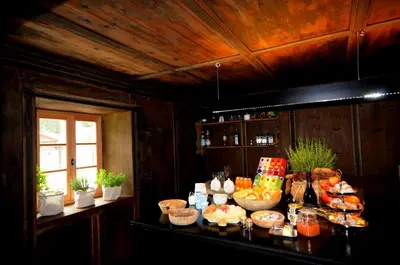 a table with a bunch of food on it at Steinwandterhof in Braies