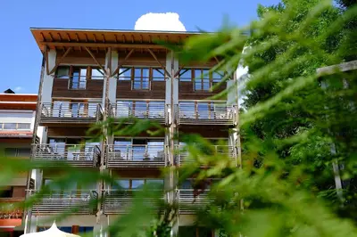 a building with balconies on the side of it at Frida am Wald in Rasùn di Sotto