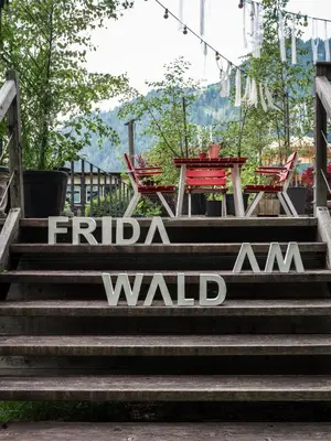 a set of stairs with a sign that reads fida am wall at Frida am Wald in Rasùn di Sotto