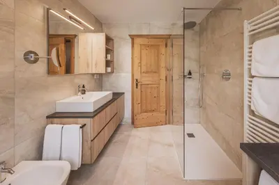 a bathroom with a sink and a toilet and a shower at App. Désirée in San Vigilio Di Marebbe