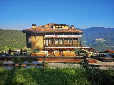 a large building on top of a hill at Maso Sveseri in Montesover