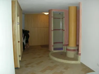a bathroom with a shower and ailed floor at DOLOMITI appart&rooms in Varena