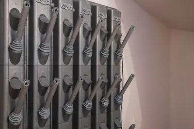 a bunch of utensils hanging on a wall at Kronplatz Lodge Dolomites in San Vigilio Di Marebbe