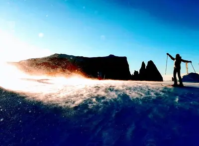 a person is standing on skis in the snow at Dolomitica, nuovo, fino a 6 Persone in Vols am Schlern