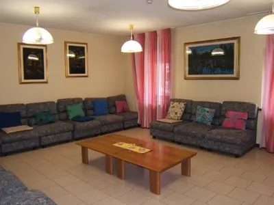 a living room with two couches and a coffee table at Casa Montana S. Maddalena in San Vito di Cadore