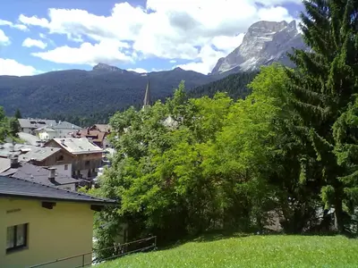 a view of a town with a mountain in the background at Casa Montana S. Maddalena in San Vito di Cadore