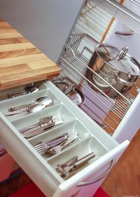 a drawer in a refrigerator filled with lots of utensils at Laubenapartment in Merano