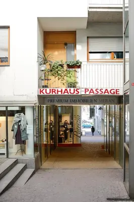 a store front with a sign that reads kimonos passage at Laubenapartment in Merano