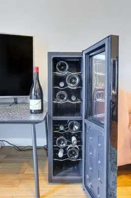 a bottle of wine in an open refrigerator at Penthouse Jolanda Meran-o in Merano