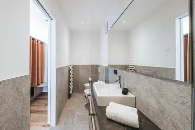 a bathroom with a sink and a mirror at Lochbauer in Meltina