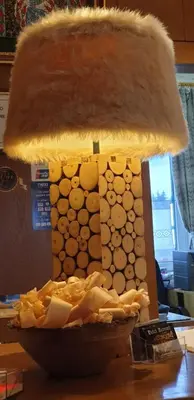 a gingerbread house with a light on a table at Albergo Bernard in Canazei