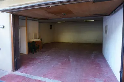 an empty room with a desk in a building at Casa Dorich in Pozza di Fassa