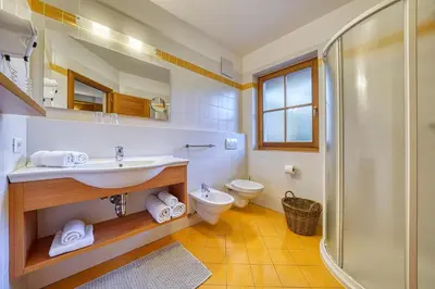a bathroom with a sink and a toilet and a shower at Appartements Riegelehof in Laion