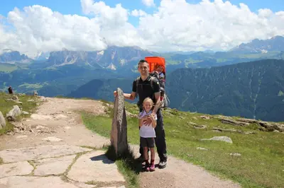 a man and a child standing on top of a mountain at Appartements Riegelehof in Laion