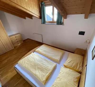 a small room with two beds in it at Blummerhof in Lagundo