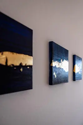 three pictures are hanging on a wall at Haus Lasaun in Bressanone