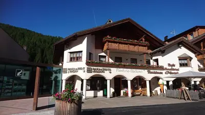 a bakery with a display case in a store at Residence Ploner in San Cassiano