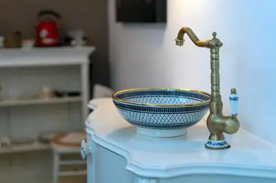 a sink with a faucet on a blue counter at Il Florino in Merano