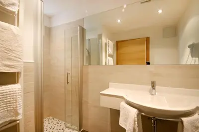 a bathroom with a sink and a shower at Plarserhof in Lagundo