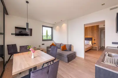 a living room with a table and a couch at Plarserhof in Lagundo