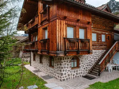 a large wooden house with a balcony on top at Apartment Cesa Pra da Molin-3 by Interhome in Campitello