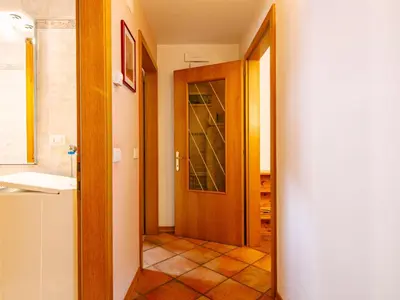 a bathroom with a sink and a toilet and a mirror at Apartment Cesa Pra da Molin-3 by Interhome in Campitello